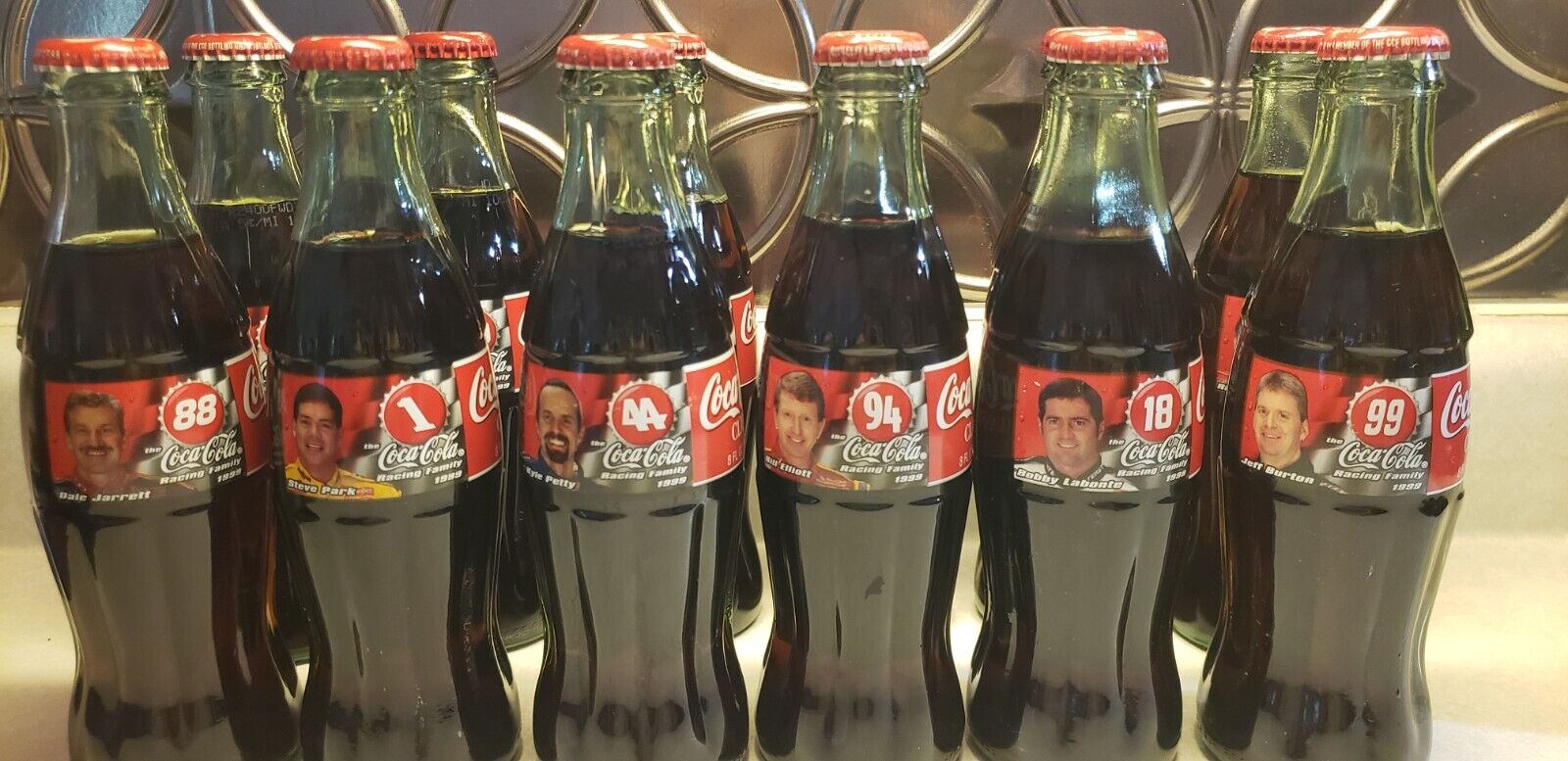 2- 6 pk. Coca-Cola racing family bottles from 1999