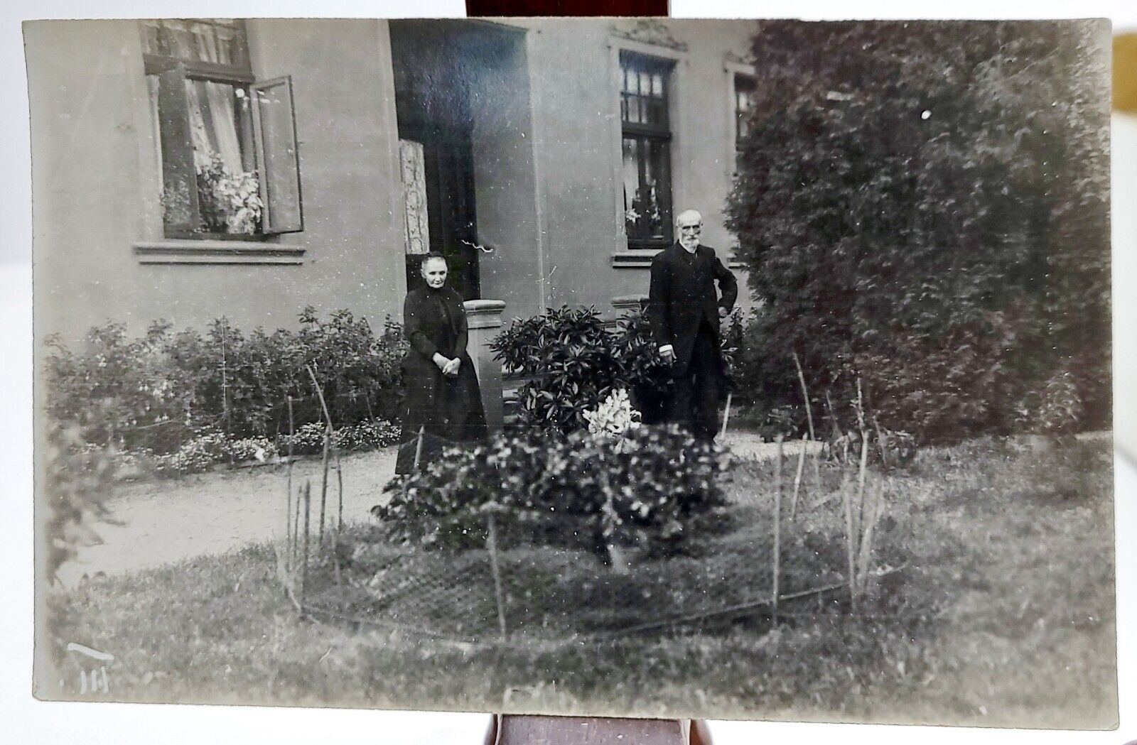 Antique Real Photo Postcard Older Couple in Garden by House