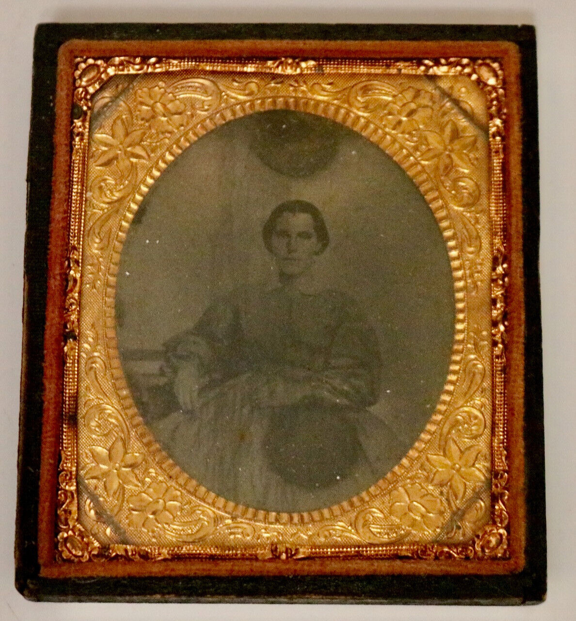 antique vintage tintype photo of woman in ornate frame