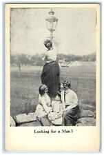 c1910's Woman Climbing Street Light Looking At Man Unposted Antique Postcard picture