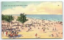 1940s MIAMI BEACH FL PALMS SAND SURF BEACHSIDE SUNBATHING POSTCARD P2444 picture